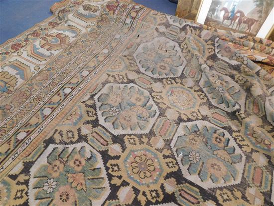 A large Indian carpet, circa 1910, 16ft 1in x 21ft 4in. (652cm x 491cm), fragment 5ft 11in. x 3ft 6in.